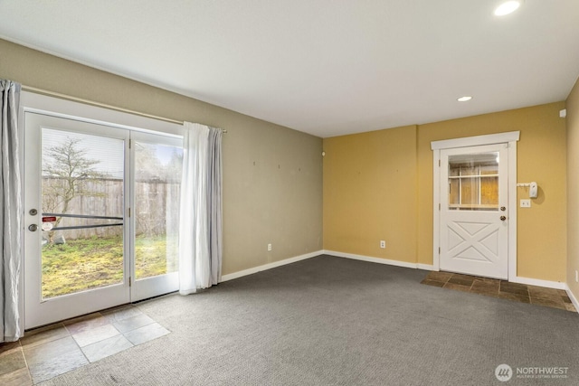 spare room with recessed lighting, baseboards, and carpet