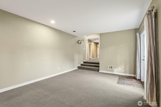 carpeted spare room with visible vents, recessed lighting, stairs, and baseboards