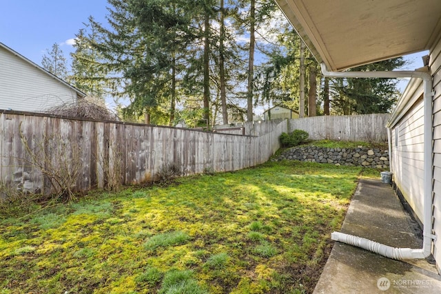 view of yard with a fenced backyard