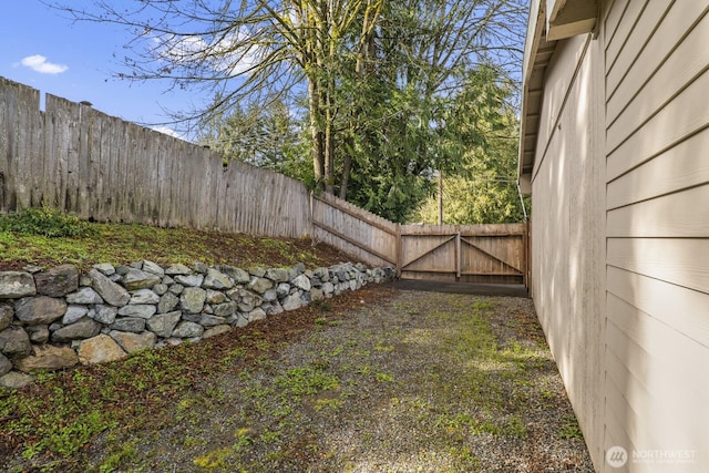 view of yard with a gate and fence