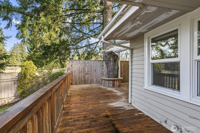 deck with a fenced backyard