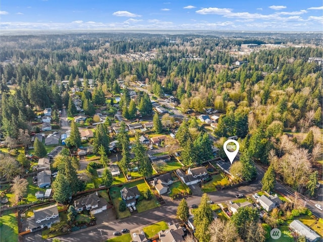 bird's eye view featuring a residential view and a view of trees