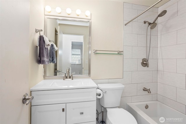 bathroom with toilet, shower / bathtub combination, tile walls, and vanity