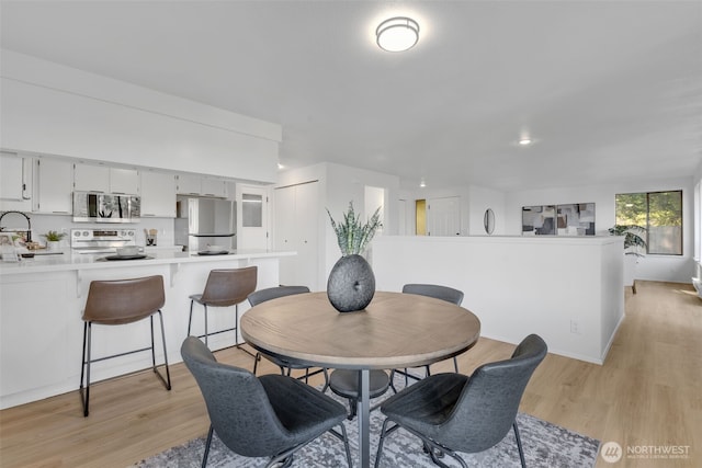 dining room featuring light wood-type flooring