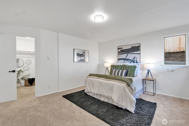 bedroom with baseboards and carpet flooring