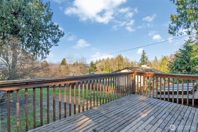 deck featuring a lawn