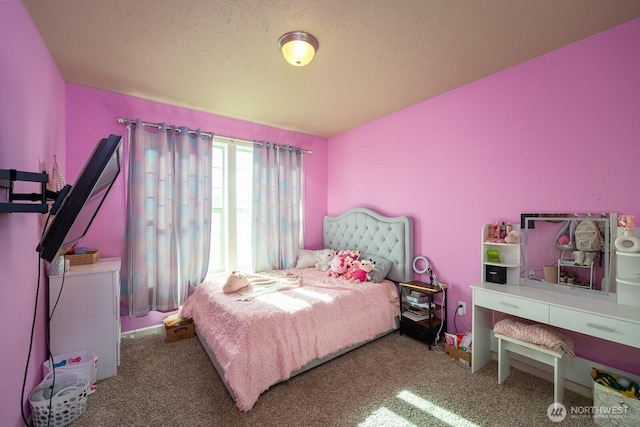 bedroom with carpet and a textured ceiling