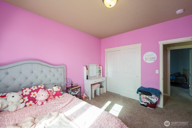 bedroom featuring carpet and a closet