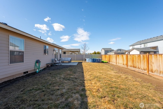 view of yard with a patio area and a fenced backyard