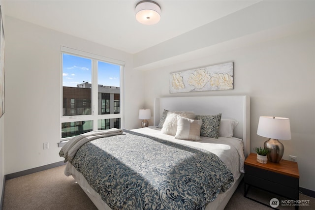 carpeted bedroom with baseboards
