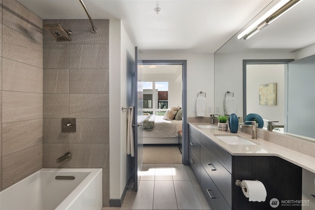 full bathroom with a sink, double vanity, ensuite bath, and tile patterned floors