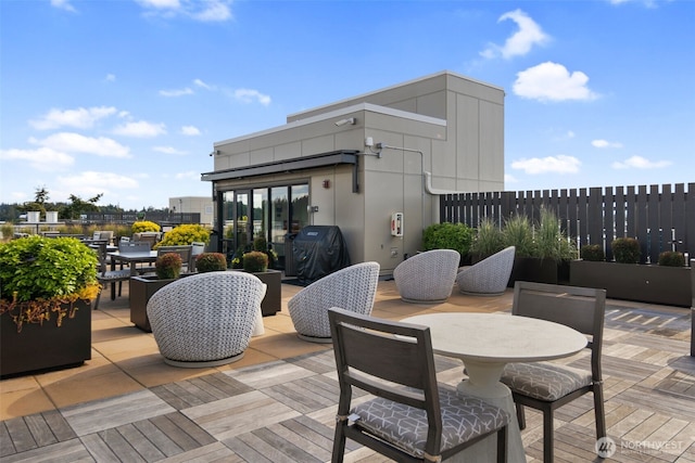 view of patio featuring grilling area and outdoor dining area