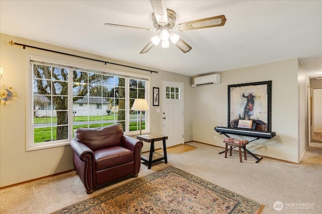 living area featuring a wall mounted air conditioner, baseboards, carpet, and a ceiling fan