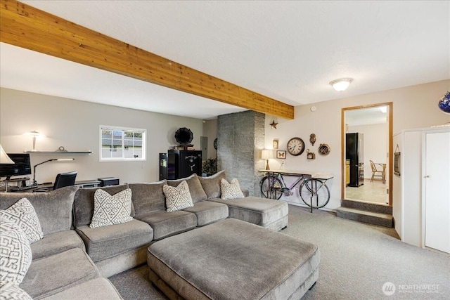 living area featuring beamed ceiling and carpet floors