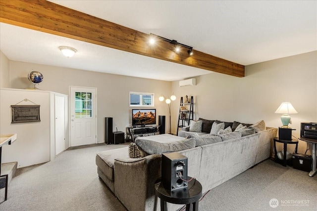 living room with beamed ceiling, light colored carpet, a wall mounted air conditioner, and track lighting