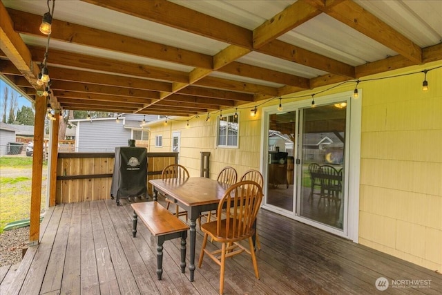 deck with outdoor dining area