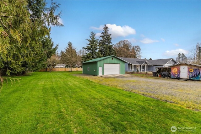 exterior space with a front lawn, a garage, and driveway