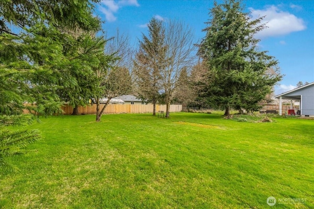 view of yard featuring fence