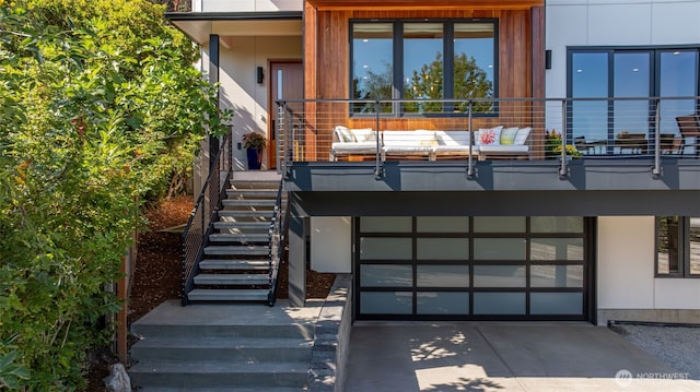 view of front of home featuring stairway and driveway