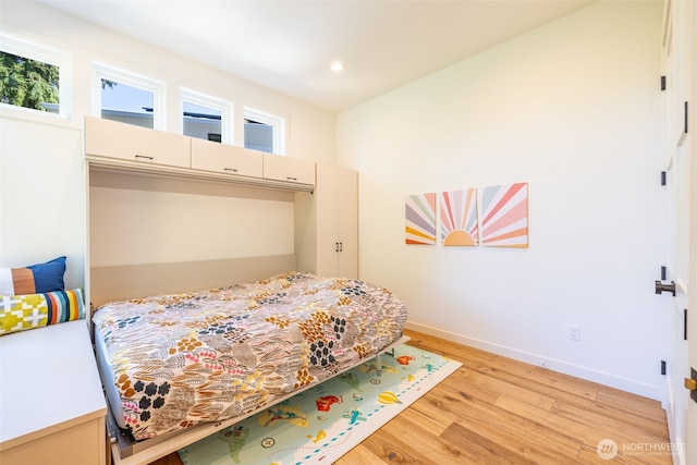 bedroom featuring recessed lighting, baseboards, and light wood finished floors