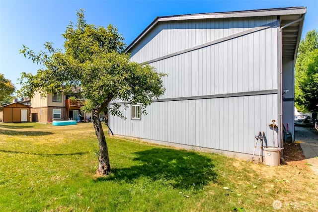 view of side of home featuring a lawn