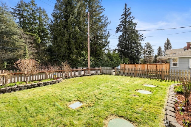 view of yard featuring a fenced backyard