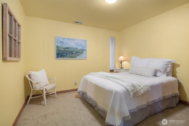 bedroom featuring baseboards, visible vents, and carpet flooring