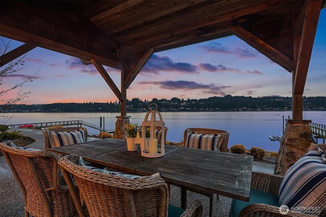 view of patio / terrace featuring outdoor dining area and a water view