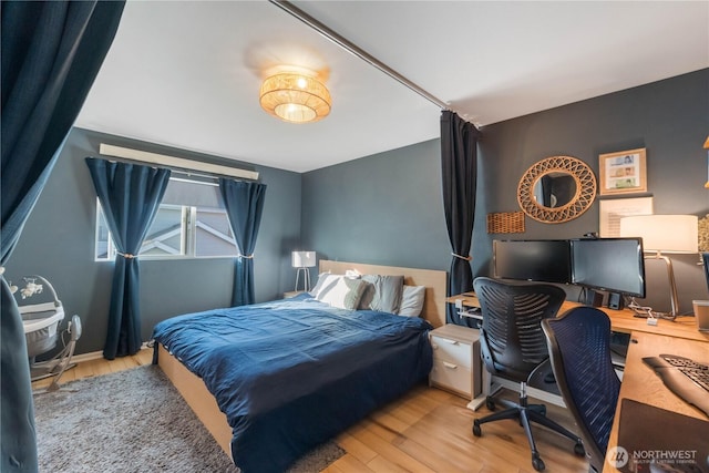 bedroom with wood finished floors