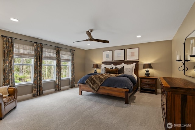 bedroom featuring light carpet, baseboards, and recessed lighting