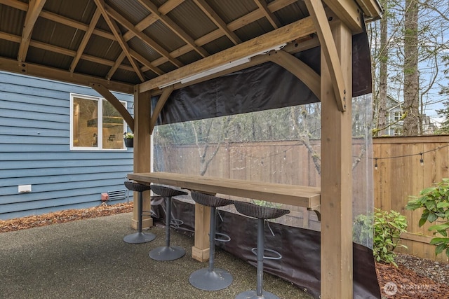 view of patio / terrace featuring fence and a gazebo