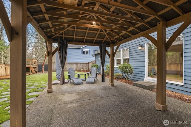 view of patio with fence and a gazebo