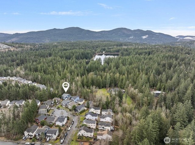 bird's eye view with a wooded view and a mountain view