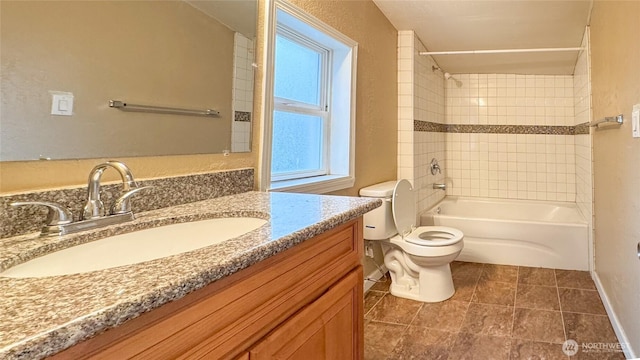 full bathroom with baseboards, toilet, tile patterned flooring, vanity, and shower / washtub combination