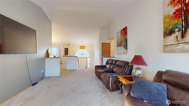 living room featuring carpet and lofted ceiling