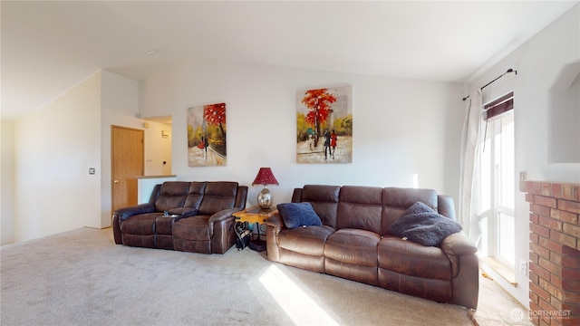 living area with vaulted ceiling and carpet flooring