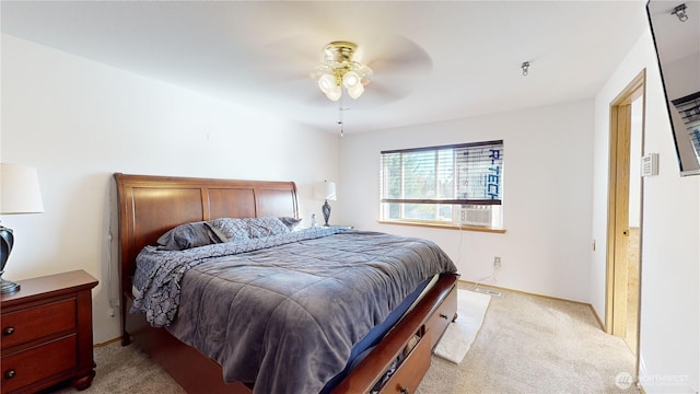 carpeted bedroom featuring cooling unit and a ceiling fan