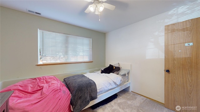 bedroom with carpet, visible vents, ceiling fan, and baseboards