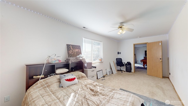 bedroom with a ceiling fan, light carpet, and visible vents