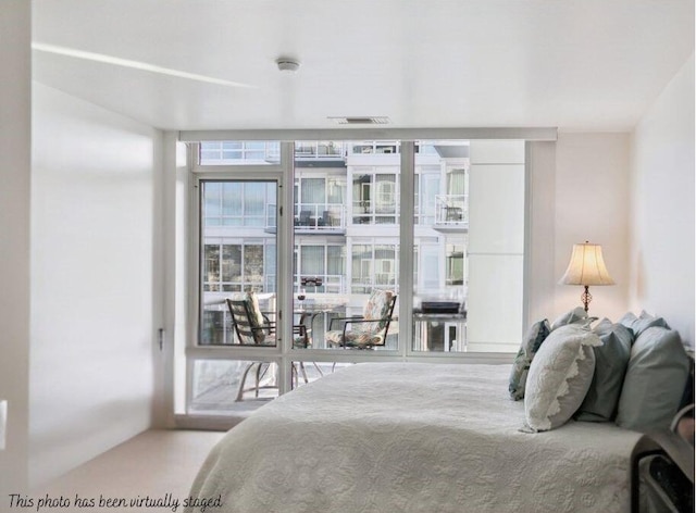 bedroom featuring visible vents and access to exterior