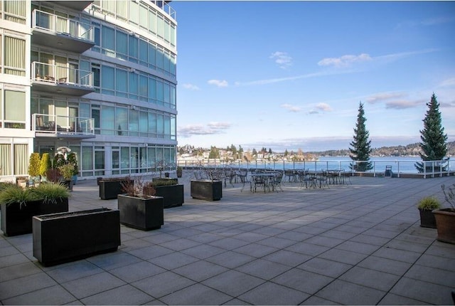 view of patio featuring a water view