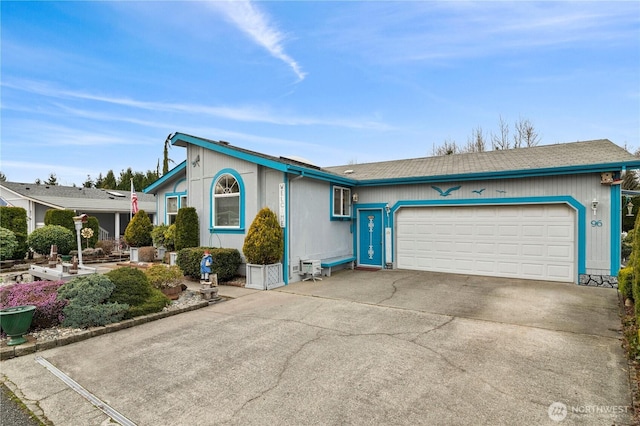 view of front of home featuring driveway and a garage