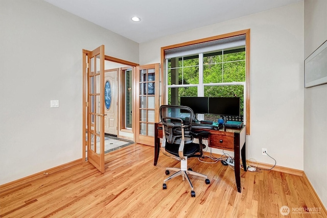 home office with recessed lighting, baseboards, wood finished floors, and french doors