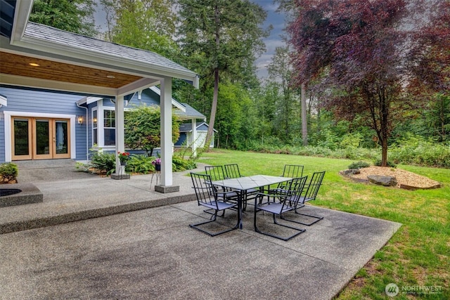 view of patio / terrace with an outdoor structure and outdoor dining space