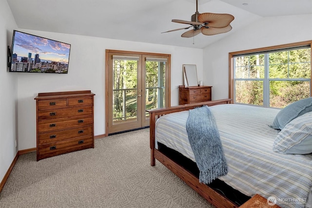 bedroom featuring lofted ceiling, access to exterior, multiple windows, and light carpet