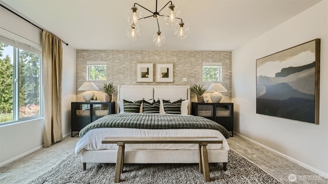 bedroom with carpet floors, multiple windows, and baseboards