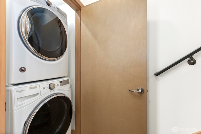 laundry area with stacked washer / dryer and laundry area