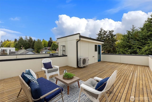 deck featuring an outdoor living space and ac unit