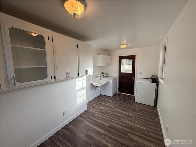 106 Alder St, Pe Ell, WA 98572 - kitchen with dark wood finished floors, light countertops, white cabinetry, separate washer and dryer, and baseboards