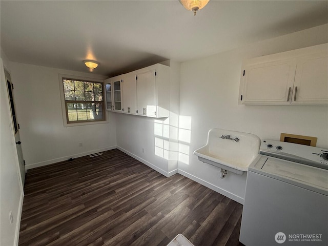 106 Alder St, Pe Ell, WA 98572 - laundry area with cabinet space, baseboards, washer / clothes dryer, dark wood-style flooring, and a sink